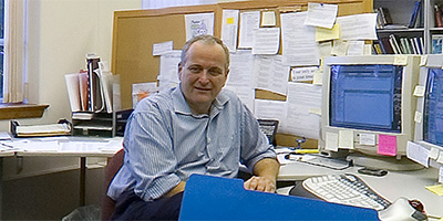Bryan Dilts at his desk at AGICC