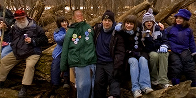 Cooler Crew in Crosby Park at the log where the 2005 Pioneer Press Treasure Hunt medallion was found.